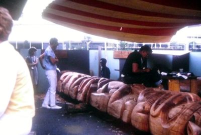 Carving a totem pole at the Alaska Pavilion