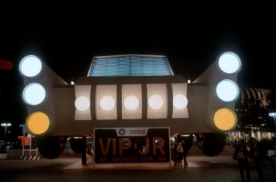 Front of Chrysler's Giant Auto illuminated at night