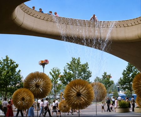 Fountains spray down on giant flowers