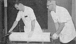 Unrolling Ektacolor paper for printing of World's Fair pictures