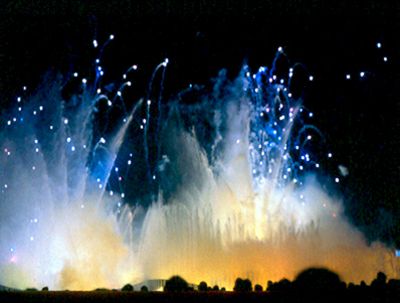 Fireworks explode over the Fountain of the Planets