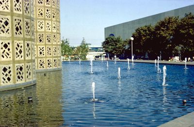 Reflecting pool and fountains surround the Hall of Science