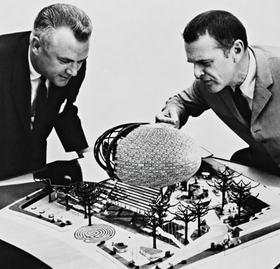 IBM Executives Examine a Model of the Pavilion