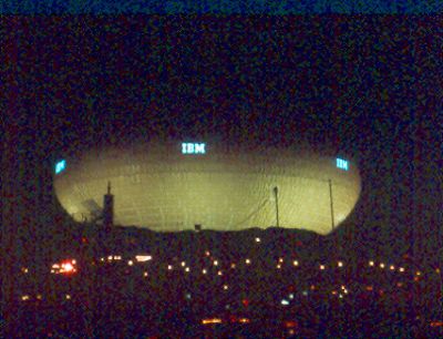 IBM Pavilion - two views of the Information Machine illuninated at night