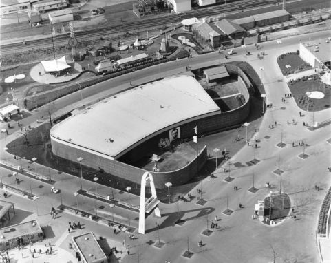 Occupying an enviable site in the State & Federal Area in close proximity to the Federal Pavilion, the Illinois building was an attractive, one-story red brick structure of continuous curved design. It was the only pavilion hosting a Disney presentation that was not designed by Disney Enterprises. This aerial view clearly shows the open courtyards and highlights the pavilion's graceful design.
