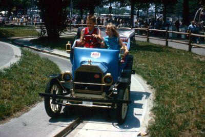 Antique model car takes visitors on ride down old-fashioned country lane at Avis Antique Car Ride