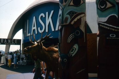 Under white, igloo-shaped dome, Alaska has exhibit of wild life, industry and Indian crafts