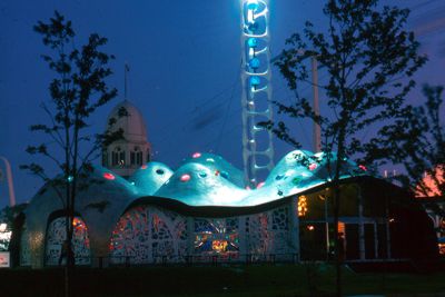 Gold mosaic and colored glass covers many-domed structure of Jordan seen at night