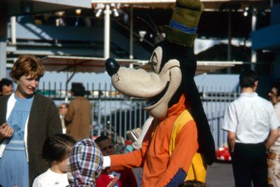 Walt Disney characters entertain children outside Pepsi-Cola Pavilion
