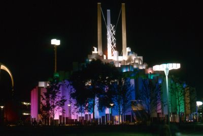Tower of Light - building rises in a forest of aluminum-faced prisms and has world's most powerful searchlight
