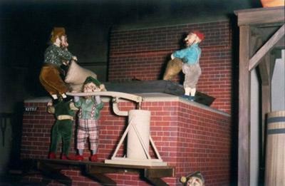 Gnomes pour and pump grains into the cooking kettle - a diorama at the Schaefer Center