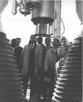 NASA astronaut Elliott See along with students who are studying to be prospective Space Park Hosts. They are looking up the "business end" of the Gemini Titan II booster.