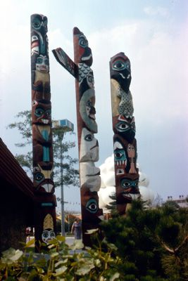 Totem poles outside the Two Thousand Tribes Pavilion
