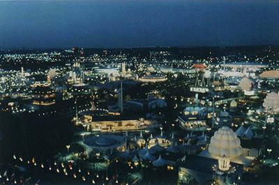 Brilliantly lighted panorama African pavilions foreground
