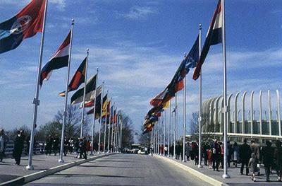 Flag-lined bridge leading to Ford Rotunda